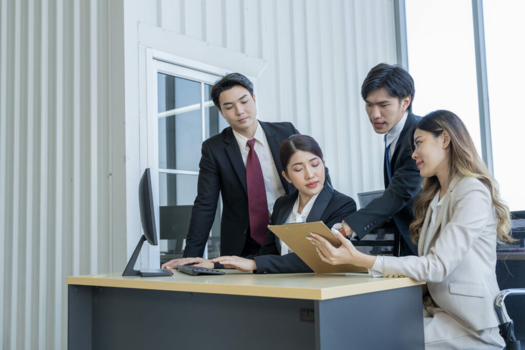 A group of young Asian businessmen Talking and planning work happily and have fun.